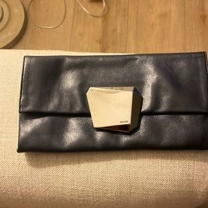 Prada clutch black leather silver snap pink interior